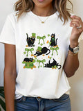 St. Patrick's Day Cute Cat Luck Design Black Cat With Green Hat & Clover Accented Graphic Print Women's T-Shirt, Short Sleeve Crew Neck Casual Top For Summer & Spring